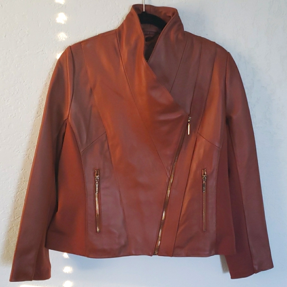 Iman's  genuine leather moto jacket. Spandex sides under arms for comfort . Med.
